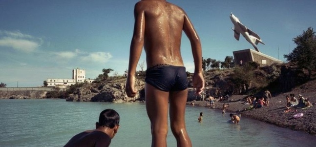 Children enjoy swimming in Lake Balkhash in Priozersk, Kazakhstan in 2011. The city was the center of the Sary-Shagan Polygon, the testing range for anti-ballistic missiles. Crédits photo — Ikuru Kuwajima