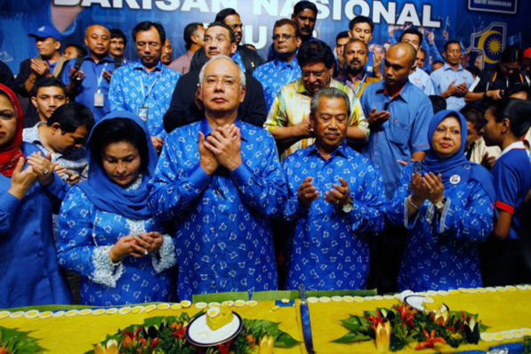 Malaysia's Prime Minister Najib Razak (second from left) celebrates his victory with a prayer on election day in Kuala Lumpur, Malaysia. Photo -- Nicky Loh/Getty Images Malaysia's Prime Minister Najib Razak (second from left) celebrates his victory with a prayer on election day in Kuala Lumpur, Malaysia. Photo -- Nicky Loh/Getty Images